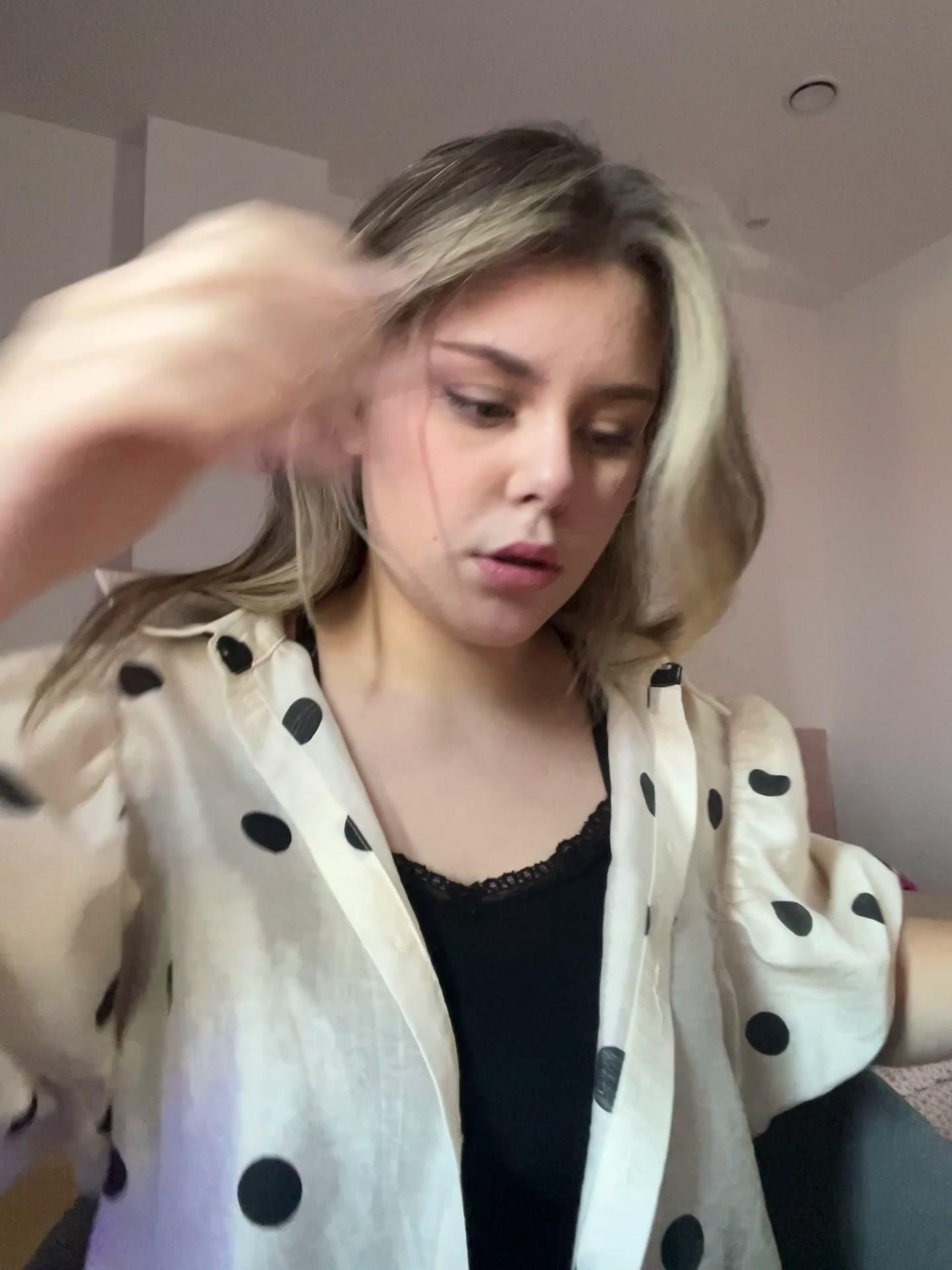 Woman Styling Hair With Pink Volume Clips