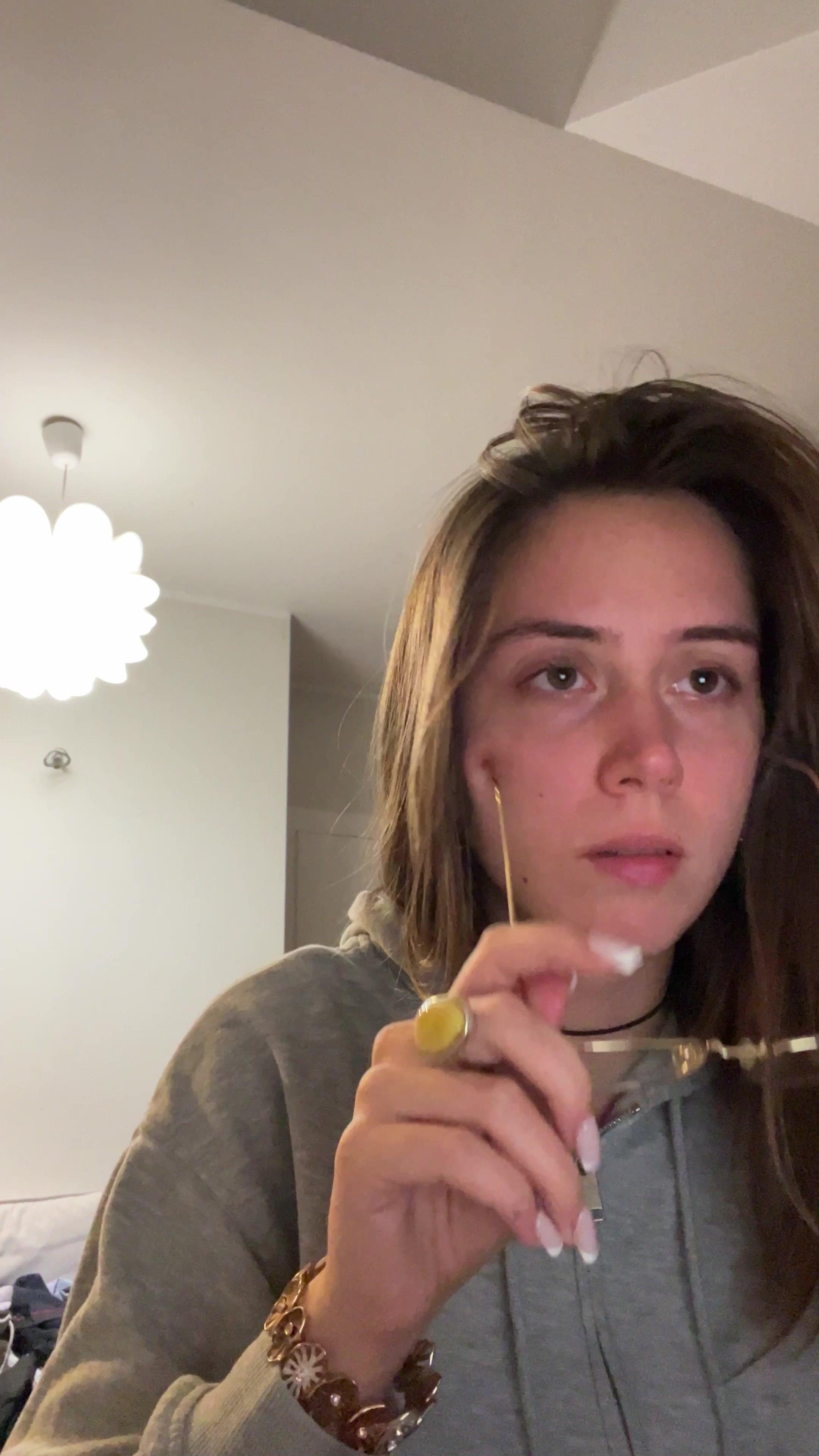 Woman Putting On Glasses and Yawning