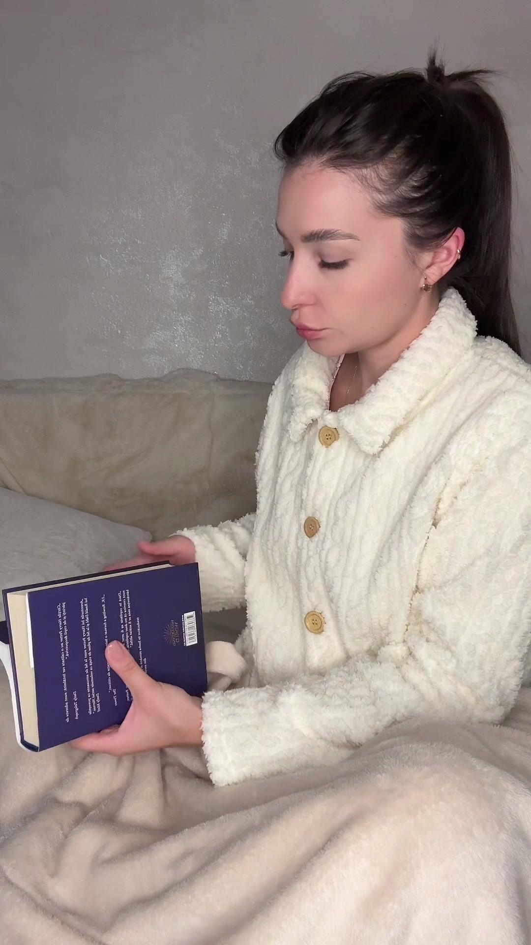 Woman Closing Book and Going to Sleep