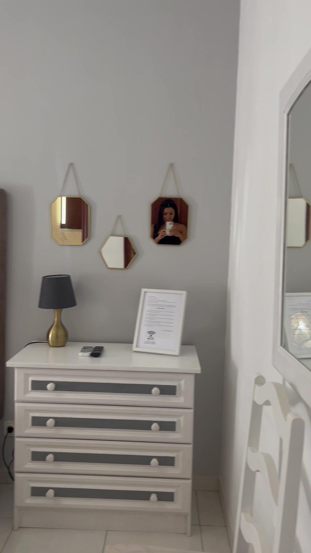 Woman Touring Modern Bedroom and Bathroom