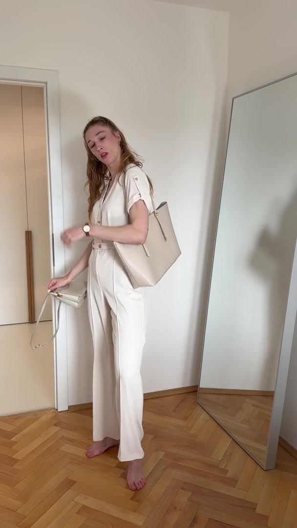 Woman Posing with Different Handbags