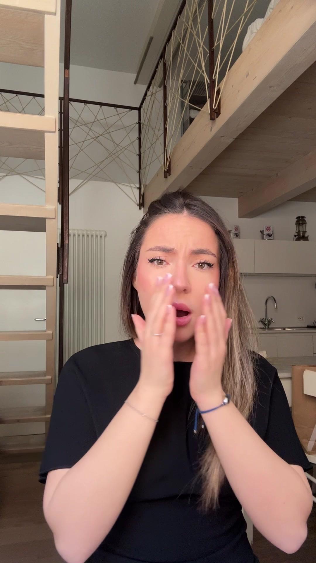 Shocked Woman Covers Mouth Then Sighs