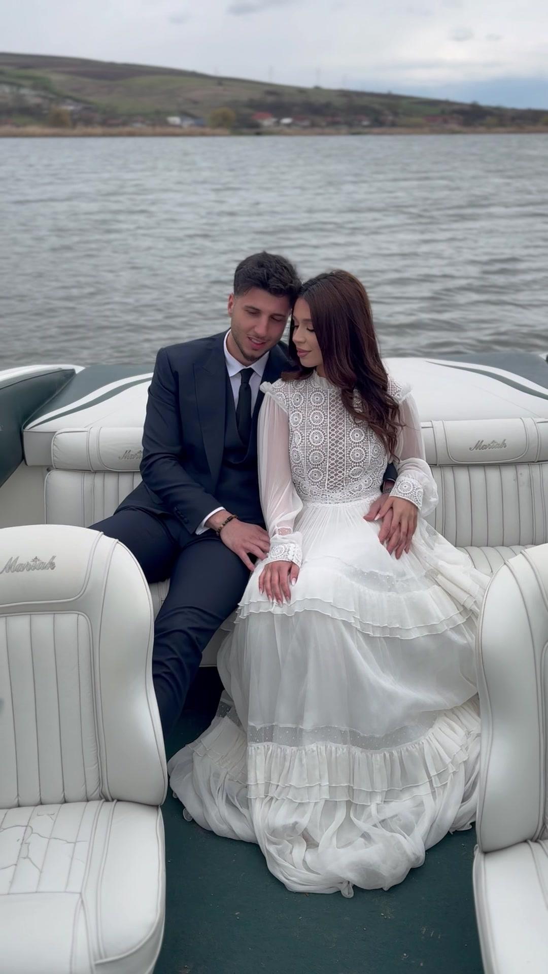 Bride and Groom Posing on Boat