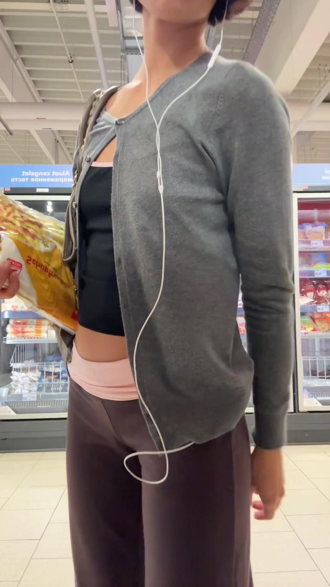 Woman Posing in Supermarket Aisle