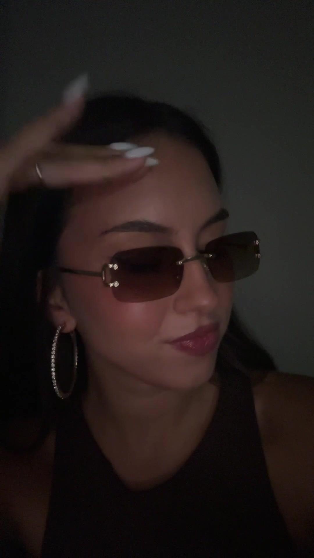 Confident Woman Posing with Sunglasses
