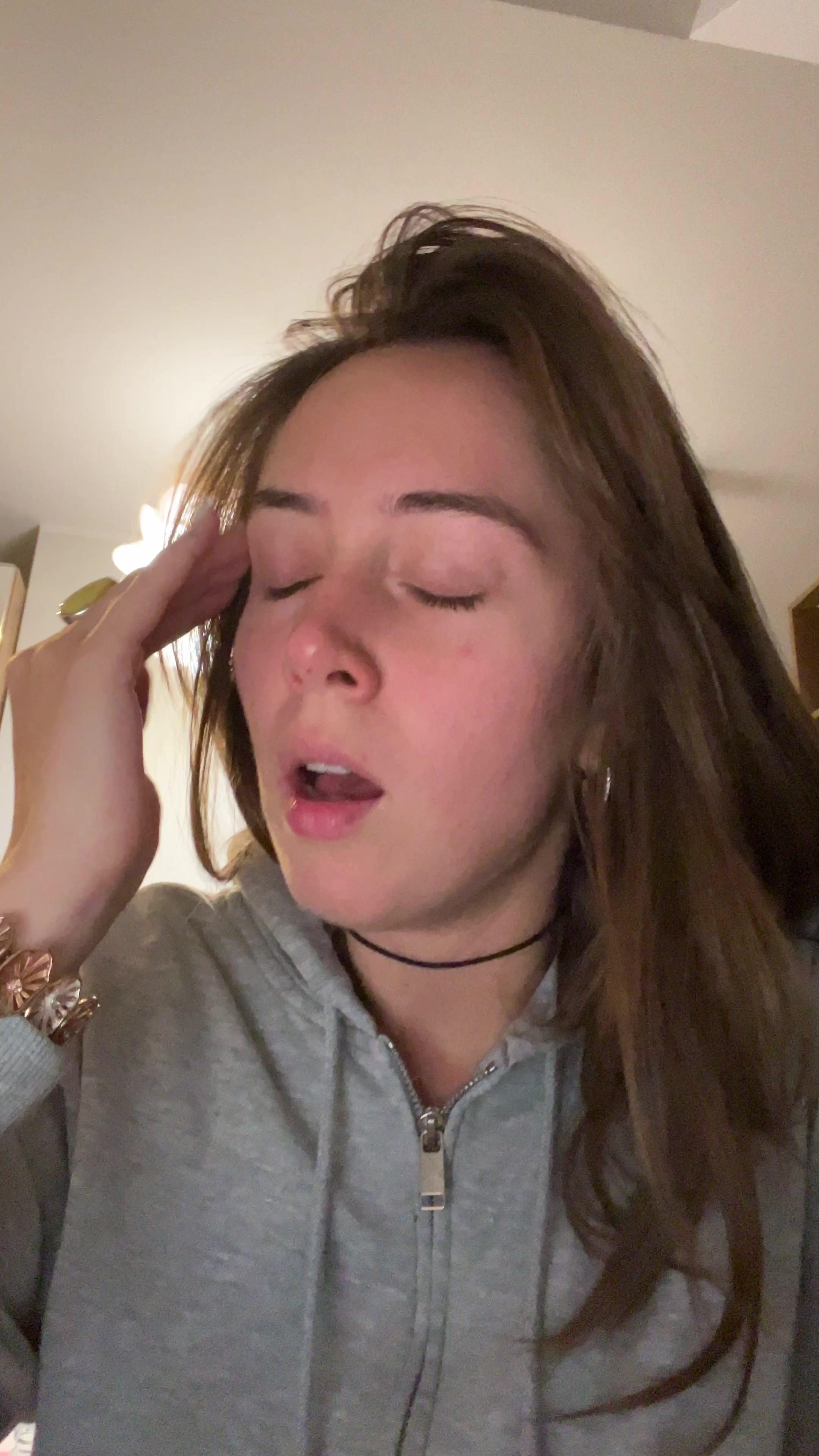Tired Young Woman Yawning Indoors