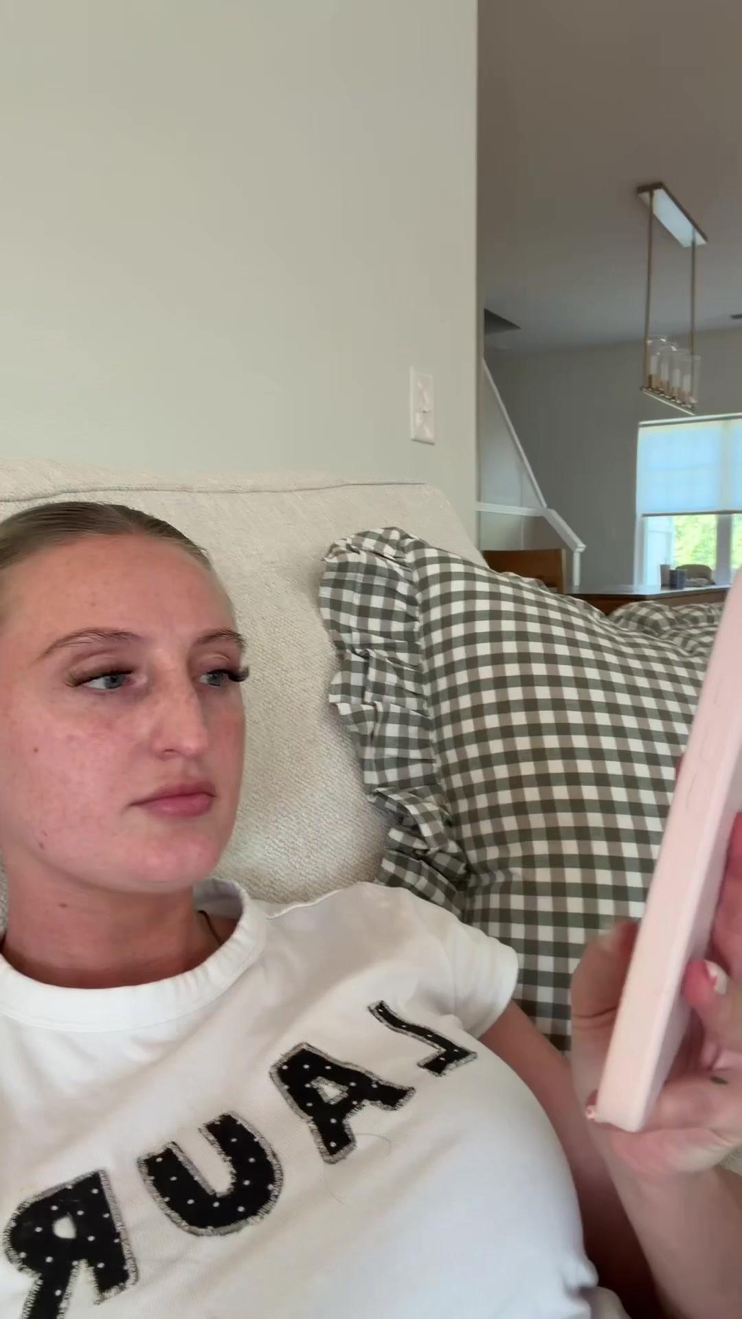 Woman Shocked While Looking at Her Phone