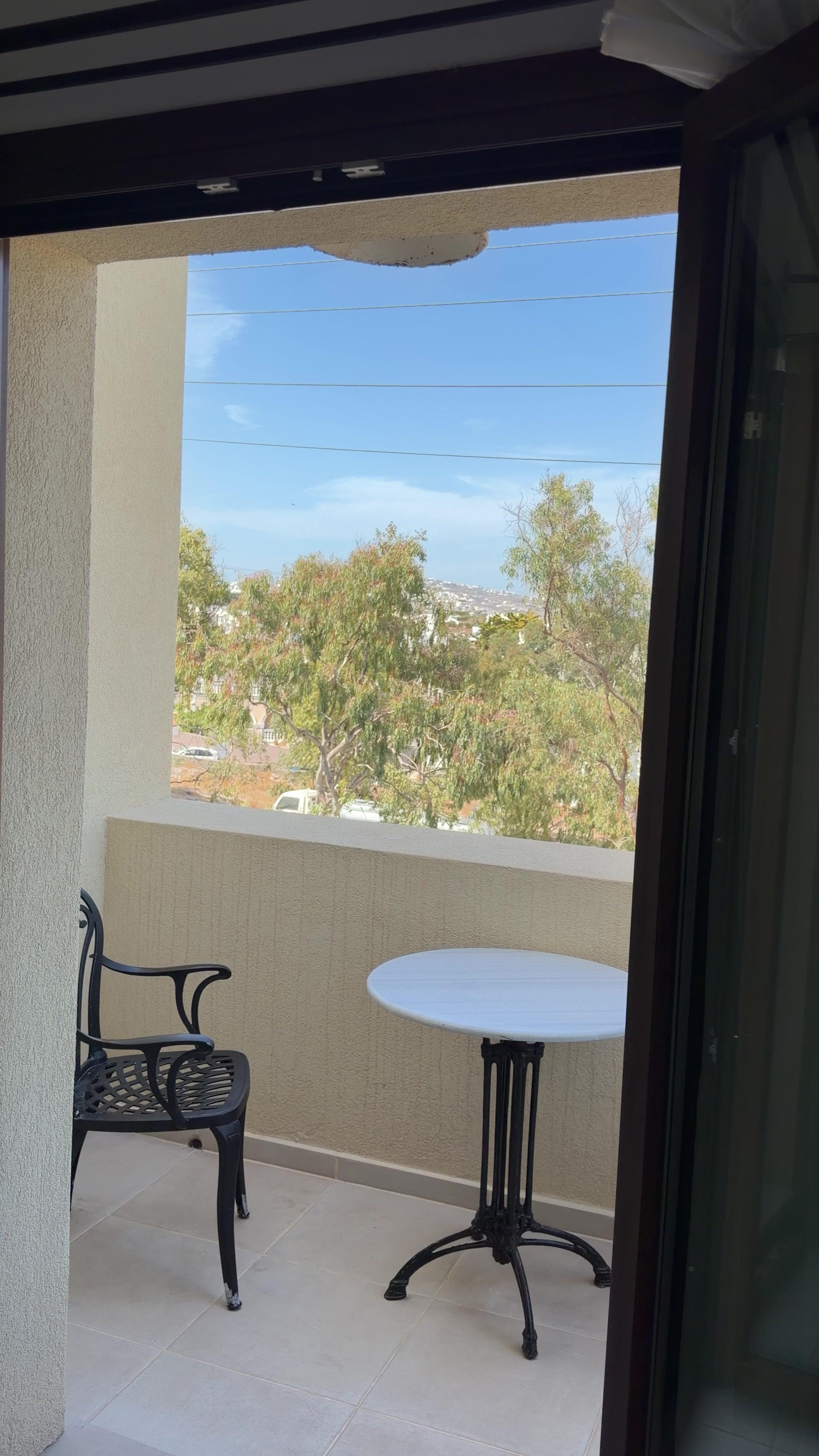 Woman Walking Onto Balcony to Enjoy View